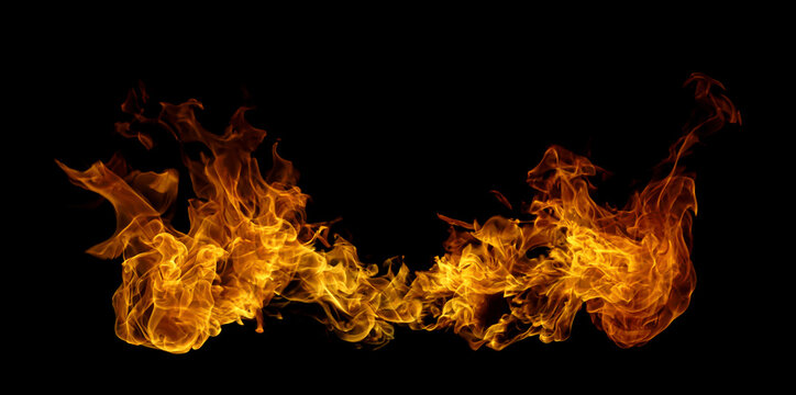 Fiery orange flames isolated on a black background, creating a dramatic abstract fire texture with glowing heat, energy, motion, and intense visual impact for creative designs and backgrounds.
