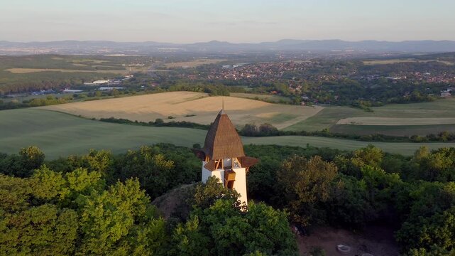 Drone aerial of St. Lszlo Lookout Chapel near Mogyor&oacute;d, Hungary, overlooking rolling hills and countryside close to the Hungaroring.