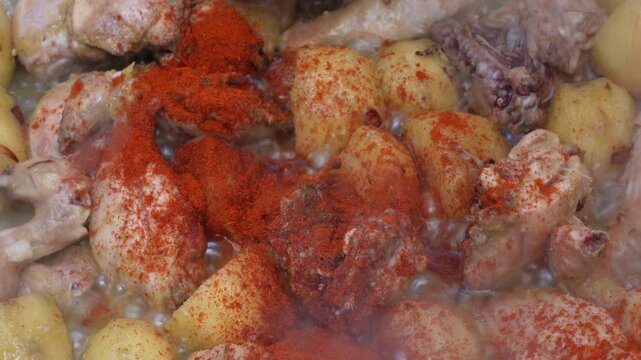 Rustic chicken and potato dish with red chili
