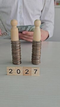 Counting coins and cash in 2027 as part of a money management activity