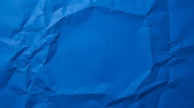 Abstract blue crumpled paper texture background with shadows and highlights