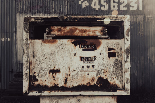 A detailed view of a heavily rusted vintage mechanical petrol pump face in Creswick Victoria Australia showing old counters