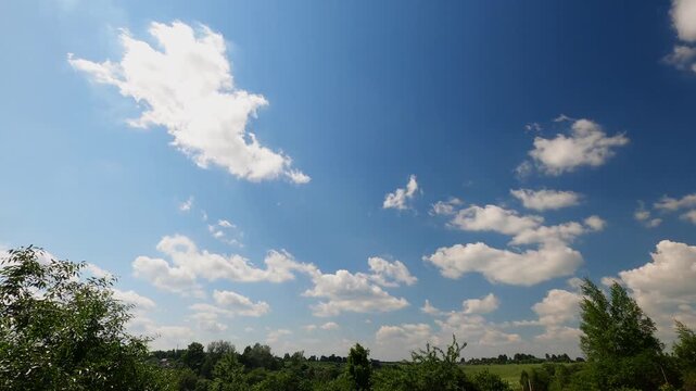 Clear Blue Summer Sky With Fluffy White Clouds Changing Shape and Moving Across the Horizon, Timelapse
