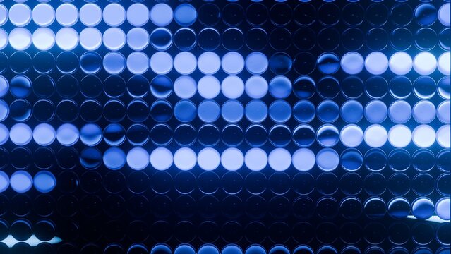 Abstract glowing blue LED circle light wall matrix pattern