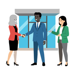 Fototapeta premium Diverse business colleagues shaking hands in front of a modern office building entrance for a professional partnership and corporate cooperation concept