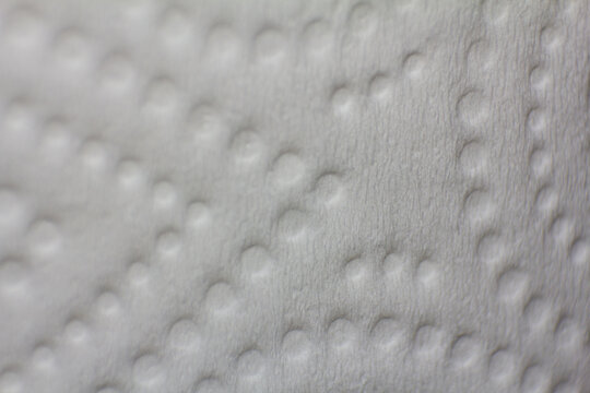 Macro Close Up Shot of Textured White Paper Surface with Embossed Pattern Details
