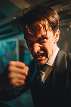 people of ai, furious disco dancer in dark formal suit raising clenched fist, photorealistic