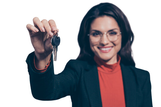 Welcome to new flat great rental service! Close-up portrait of attractive cheerful wavy-haired lady eyeglasses eyewear holding in hands giving key car sales manager isolated over gray background