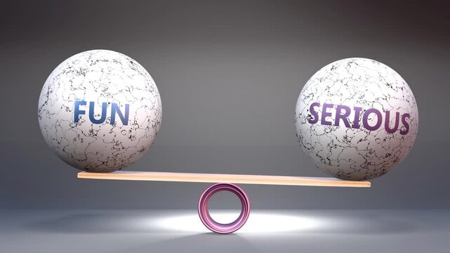 Fun and serious in balance - balancing stones on a scale symbolizing harmony, equity and equilibrium between fun and serious. Harmonious and beneficial situation.