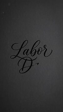 Elegant typography animation writing the word labor in cursive script on dark background