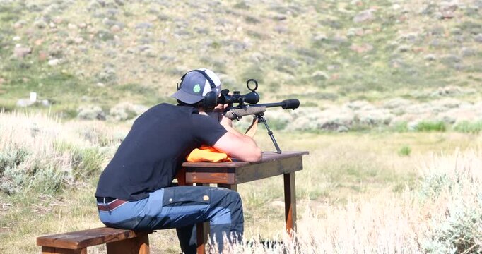 Close-up of a sniper rifle being fired during a military training exercise