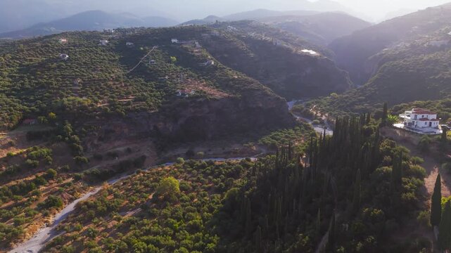 Aerial View of Dry Riverbed Winding Through Mountain Gorge Near Kitries, Greece