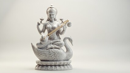 Fototapeta premium Elegant white statue of Goddess Saraswati playing a musical instrument