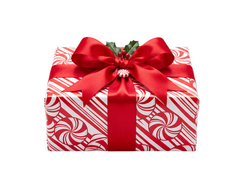 Single christmas gift box wrapped in peppermint candy pattern paper with red bow christmas peppermint wrapping december surprise
