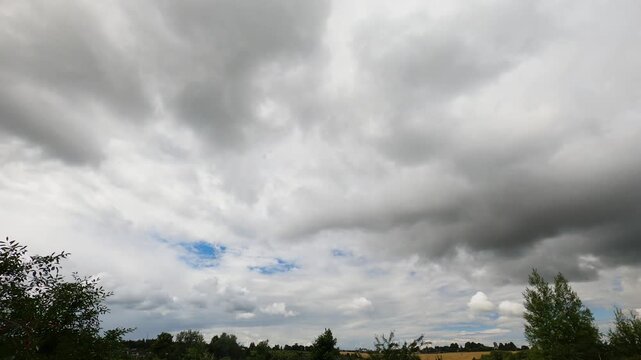 Rain Clouds Rolling Across Dark Overcast Sky Timelapse
