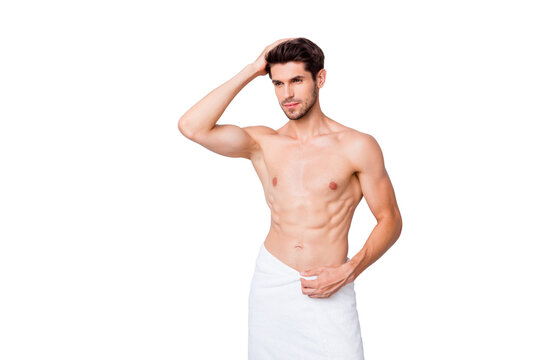 Portrait of masculine brutal masculine guy visit barbershop spa salon enjoy anti dander effect touch his shiny effect stand bath with white towel isolated grey color background