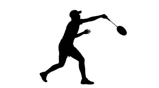 Man's silhouette in motion during a badminton smash with a racket against a bright setting