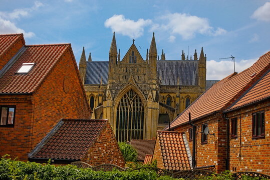 Beverley, East Riding, Yorkshire, England UK - July 29 2026: Beverley Minster Rising Behind Terraced Rooftops