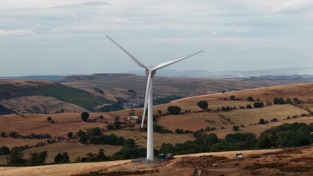 Wind Turbine on Welsh Mountain with Wildfire Smoke in Background