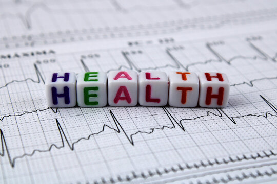 Cubes form the word health on electrocardiogram