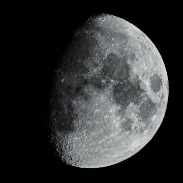 Waxing Gibbous Moon with Detailed Craters Against Black Sky