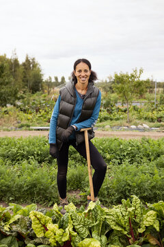 Portrait Of A Dedicated Mature Female Farmer Standing In A Field 