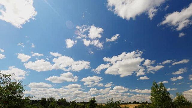 Bright Blue Summer Sky With Dynamic White Clouds Drifting Over Low Landscape Horizon, Sunny Weather Timelapse