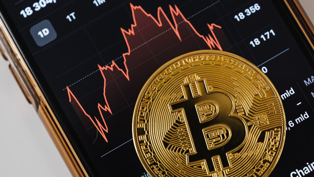 Financial trading chart and cryptocurrency token, business investment concept, studio shot