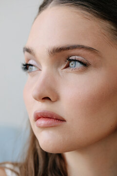 Crop face of pretty woman with blue eyes