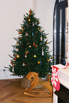 Christmas tree decorating garland and toys at home.
