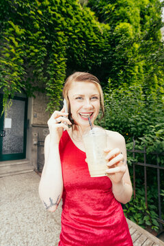 Woman in Red Dress on Phone
