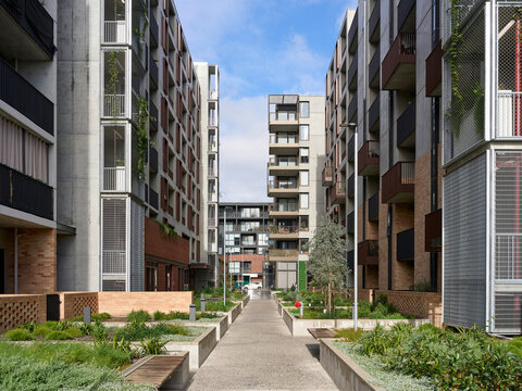 Modern Apartment Complex With Pathways and Greenery