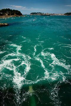 Tidal power currents from underwater turbine, eddies ebb and flow