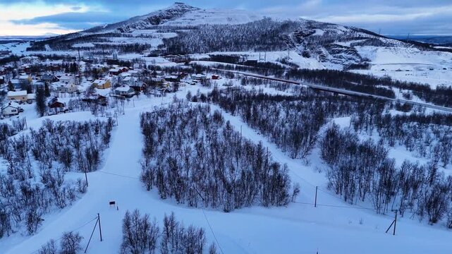 Aerial landscape view of Kiruna mining town and snow covered Kirunavaara mountain in winter (Sweden)