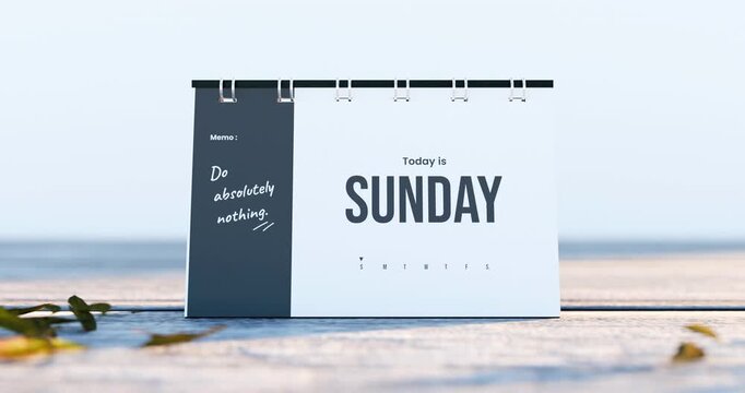 Desk calendar showing sunday and do absolutely nothing memo with moving morning sunlight in outdoor setting