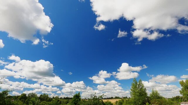 Dynamic Summer Cloudscape With White Cumulus Clouds Moving Across Blue Sky, Daytime Weather Background