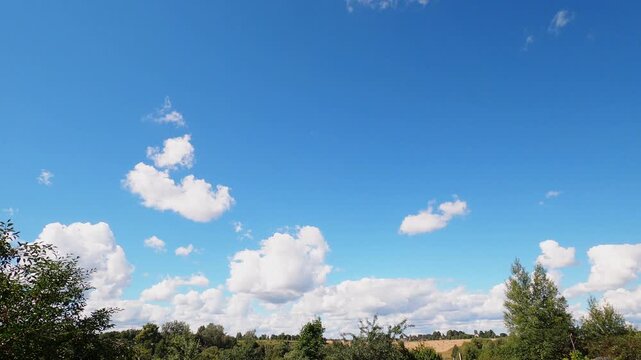 Fast Moving White Clouds Across Bright Blue Summer Sky, Dynamic Cloudscape and Weather Timelapse Background
