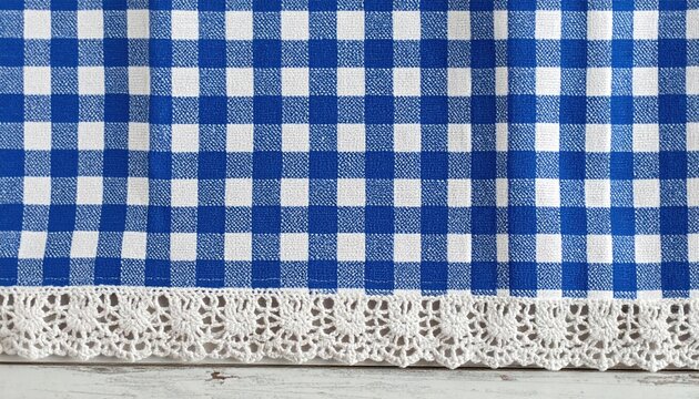 small rectangular blue gingham cloth napkin with crocheted lace edge, detailed woven cotton texture