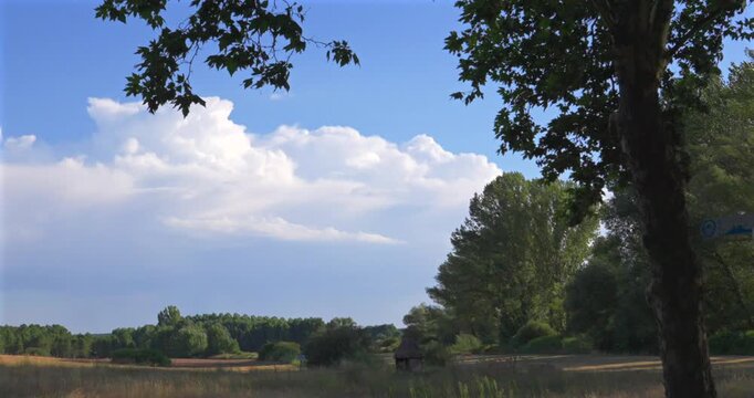 White clouds moving over a rural landscape in Quintana Redonda