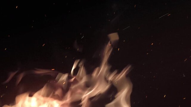 Flames burning wit hFiery sparks floating overlay on black background. backgrounds rendering. 4K Video