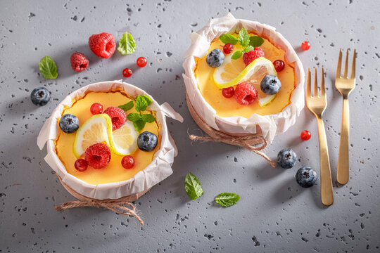 Traditional lemon curd portions presented in wooden molds.