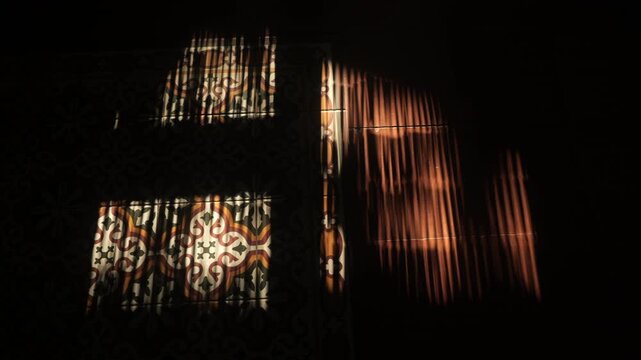 Sunspots and light patterns on beautiful clay tiled floor in Spanish country house.