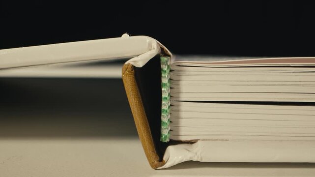 Book new textbook binding close up school university education study literature paper macro