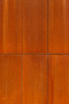 Rusted corten steel panels texture background with vertical lines and weathering