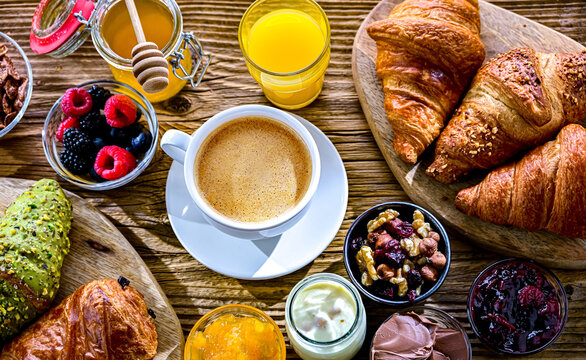 Italian breakfast served with croissants orange juice and coffee