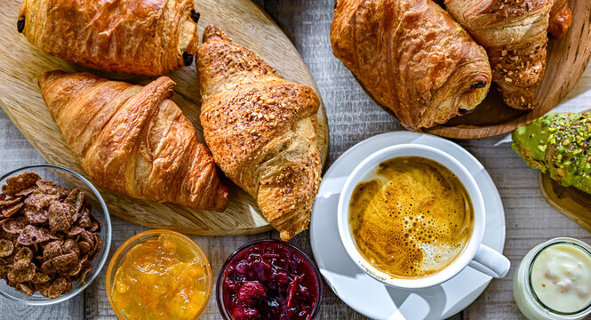Italian breakfast served with croissants orange juice and coffee