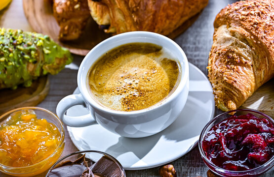 Italian breakfast served with croissants orange juice and coffee