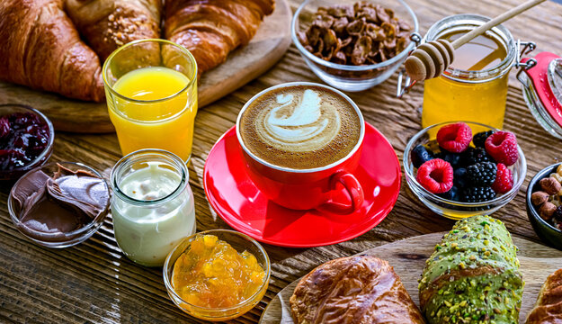 Italian breakfast served with croissants orange juice and coffee