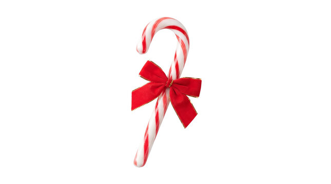 Decorative peppermint candy cane featuring festive bright red bow isolated on solid white studio background