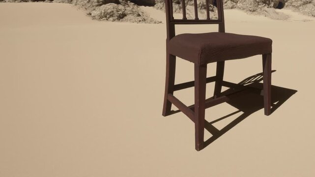 A chair stands alone on a sandy area. Sunlight shines down, casting a shadow on the ground. There are no people or other objects in sight. The scene shows an empty space.